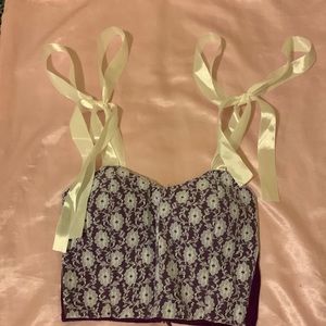 Purple and white bustier top, zips up at the back. Size small